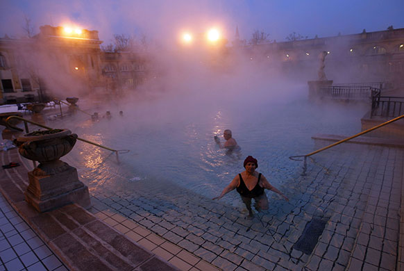 24 hours in pictures: Bathers relax in Szechenyi Bath during a winter morning in Budapest