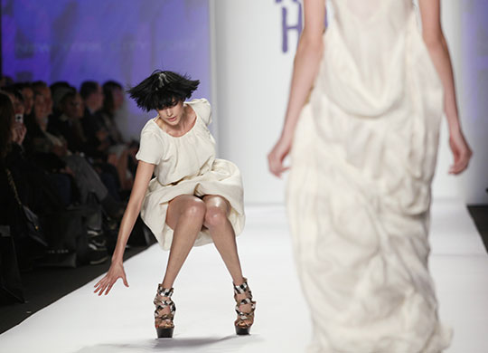 24 Hours in Pictures: A model falls on the runway at Naomi Campbell's Fashion For Relief