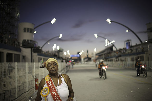 24 hours: Sao Paulo, Brazil: A reveller leaves the Sambadrome