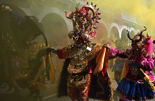 24 hours: Oruro, Bolivia: Dancers perform during carnival celebrations