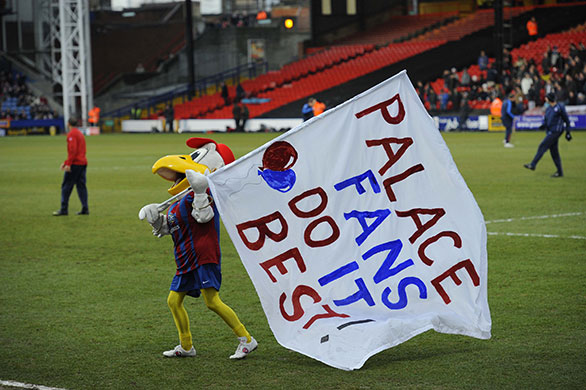 Football: Palace v Villa: The Palace eagle mascot tries to get the crowd going before the game
