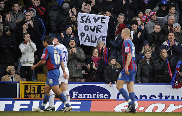 Football: Palace v Villa: A fan holds up a Save our Palace banner at half-time