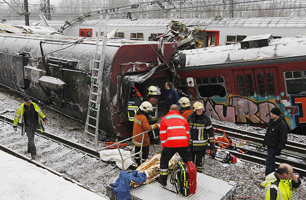 Train crash in Belgium: Rescue team workers retrieve victims of a train crash