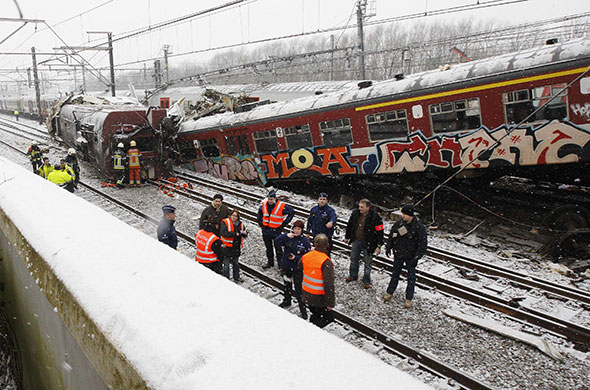 Train crash in Belgium: Emergency crews work on the site where two trains crashed 