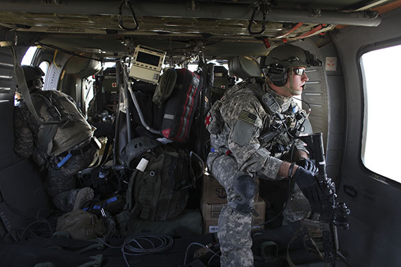 Operation Moshtarak : US Army flight medic flies on a pickup mission over Marjah