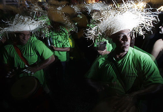24 hours in pictures: Panama City, Panama: Men drum during carnival celebrations