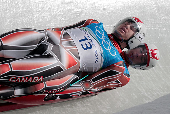 Winter Olympics day 5: Tristan Walker, top, and Justin Snith practice men's doubles luge training
