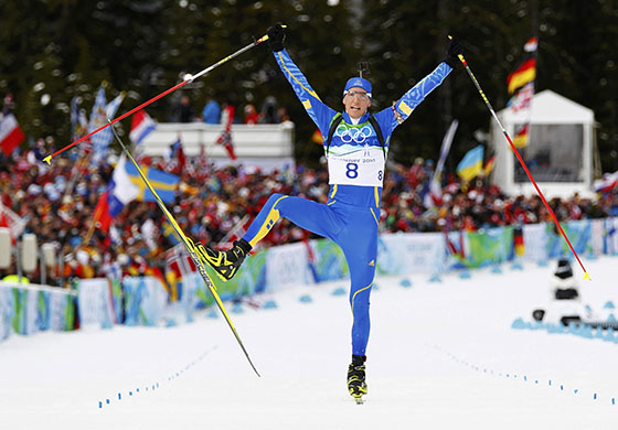 Winter Olympics day 5: Sweden's Bjorn Ferry celebrates winning the men's 12.5 km pursuit biathlon 