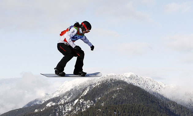 Winter Olympics day 5: Canada's Maelle Ricker races en route to the gold medal in snowboard cross