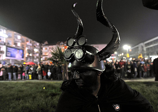 24 hours in pictures: Strumica, Macedonia: A man in fancy dress during a carnival procession 