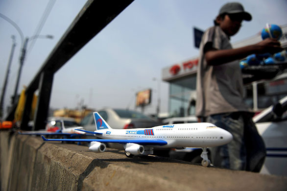 24 hours in pictures: Lima, Peru: Toys are sold on the side of a street 