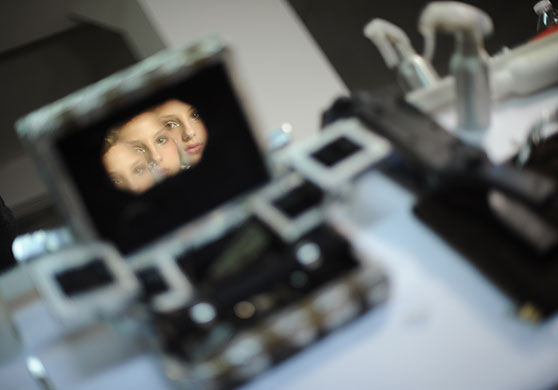 24 hours in pictures: New York, US: A model is reflected in a broken mirror at Fashion week