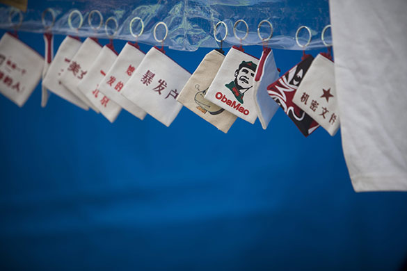 24 hours in pictures: Beijing, China: The face of President Barrack Obama portrayed as Obamao