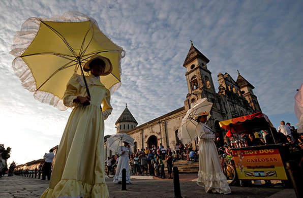24 hours in pictures: Granada, Nicaragua: Young women take part in a parade at Festival of Poetry