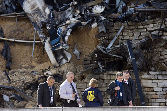 Austin plane crash: Officials inspect an area Austin plane crash