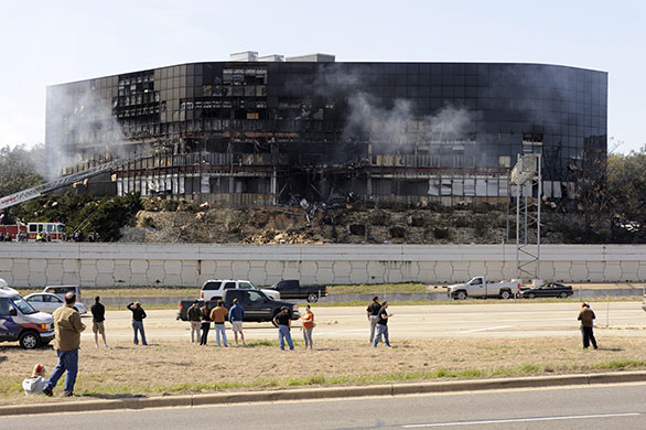 Austin plane crash: Bystanders watch as firefighters control the fire