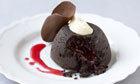 Gooey chocolate cake with spiced plum coulis recipe