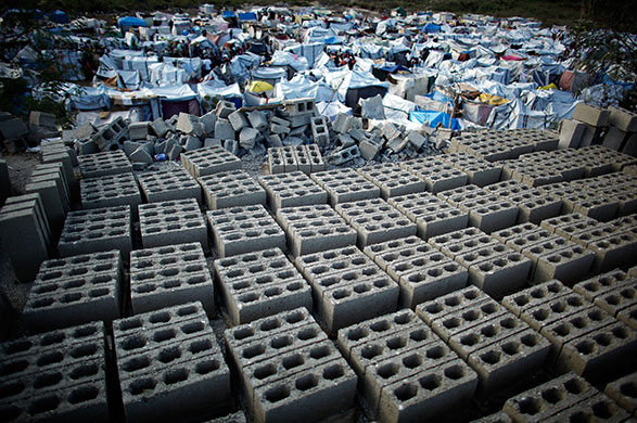 24 hours in pictures: Newly pressed bricks dry on the hill above the Marassa Camp Haiti