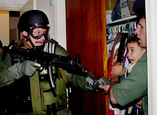 Elian Timeline: Elian Gonzalez, held by Donato Dalrymple, is taken by U.S. federal agents