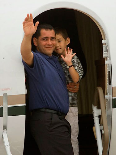 Elian Timeline: Elian Gonzalez and his father Juan Miguel Gonzalez wave goodbye