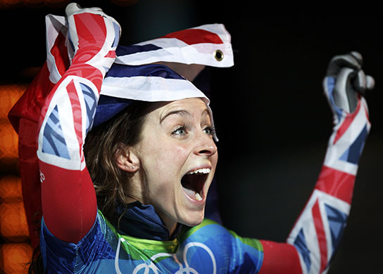 24 Hours in Pictures: Britain's Amy Williams celebrates her victory in the women's skeleton