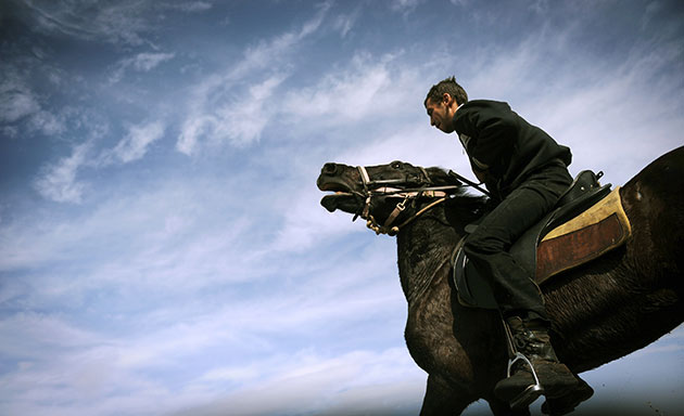 24 Hours in Pictures: A man rides his horse during the traditional Todorov Den festival