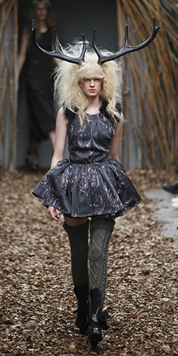 London Fashion Week: A model wears an outfit by designers Unique at London Fashion Week