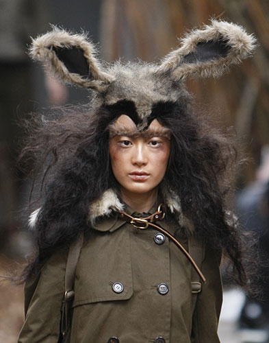 London Fashion Week: A model wears an outfit by designers Unique at London Fashion Week