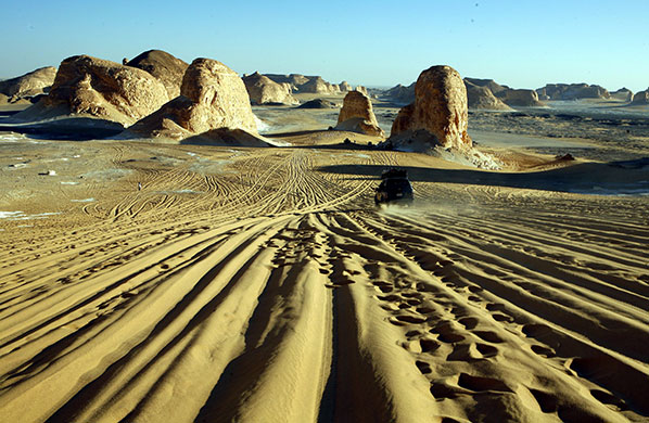 24 hours in pictures: Egypt: The setting sun casts deep shadows