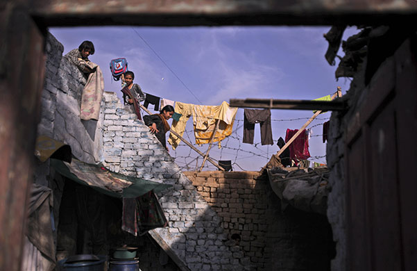 24 hours in pictures: Islamabad, Pakistan: A girl collects her family's laundry