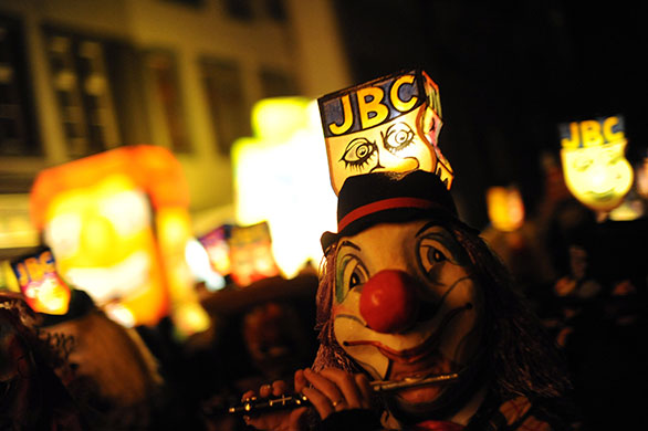 24 hours in pictures: Basel, Switzerland: Revellers parade through the streets