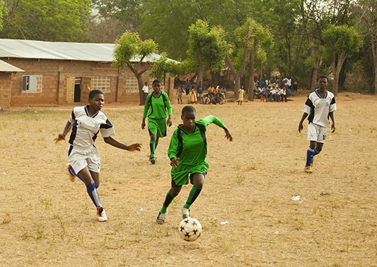 Ghana: Gifty Ansah and teammates playing in a football tournament