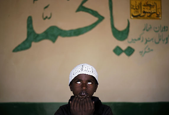 24 hours in pictures: Islamabad, Pakistan: A boy prays