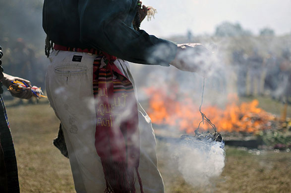 24 hours in pictures: Guatemala City, Guatemala: A Maya-descendent burns incense