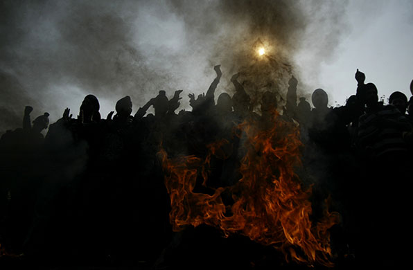 24 hours in pictures: Jammu, India: Sikh protestors burn tires