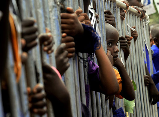 24 hours in pictures: Makueni, Kenya: Children wait to catch a glimpse of Serena Williams