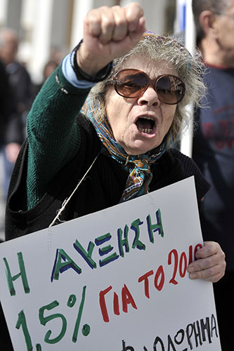 Clashes in Greece: An old woman shouts slogans during a demonstration 