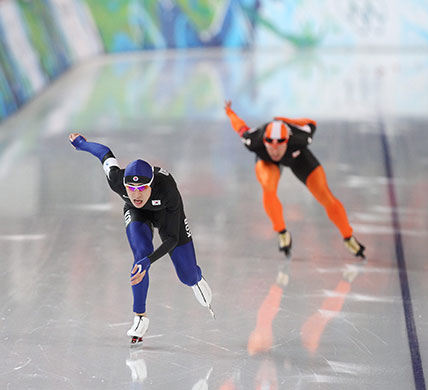 winter olympics day 12: South Korea's Seung-Hoon Lee wins the Men's 10,000 metres Speed Skating