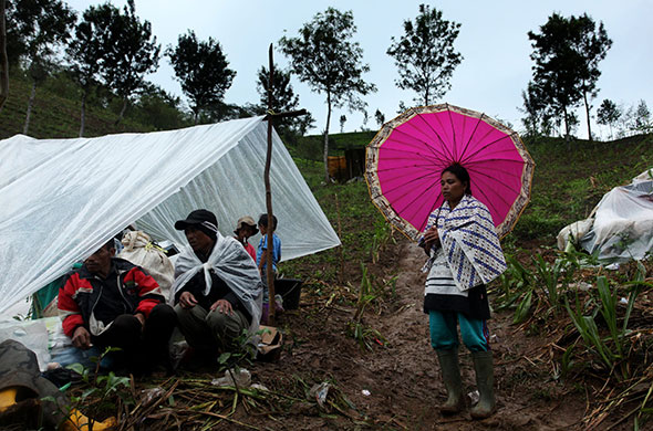 24 hours in pictures: Dewata, Indonesia: Villagers camp out as the search continues for victims
