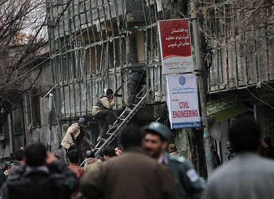 Kabul explosions: Afghan security forces climb a ladder to storm Park Residence guesthouse 
