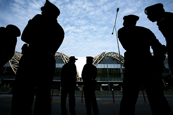 Thaksin Shinawatra: February 28 2008: Police officers stand guard outside Bangkok Airport