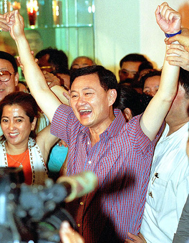 Thaksin Shinawatra: 6 January 2001: Thaksin Shinawatra and members of his party celebrate