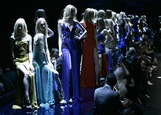 24 Hours in Pictures: Models present creations by Versace during the Milan Fashion Week