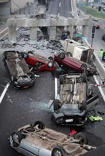 Chile Earthquake: Vehicles on a highway that collapsed during the earthquake near Santiago