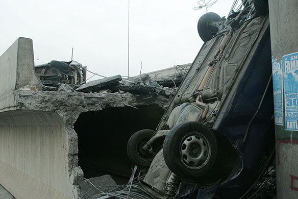 Chile Earthquake: An overturned vehicle in the concrete of a highway that collapsed