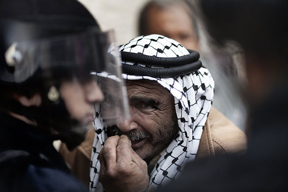 24 hours in pictures: Palestinian man pleads with Israeli police, Jerusalem