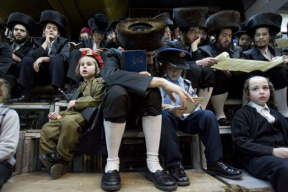 24 hours in pictures: Ultra-Orthodox Jews during the feast of Purim, Israel