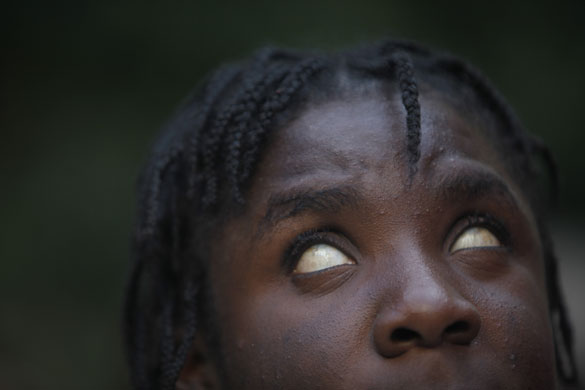 24 hours: A blind woman stands in the garden of a centre for blind people in Haiti