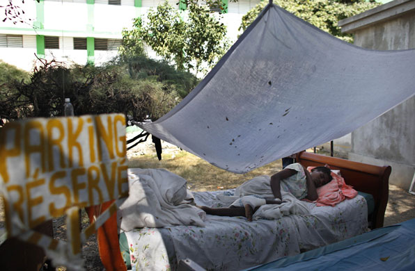 Haiti: 2 February: A woman waits to be attended by a doctor