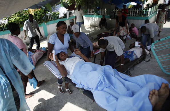 Haiti: 2 February: People wait to be attended by a doctor at the general hospital